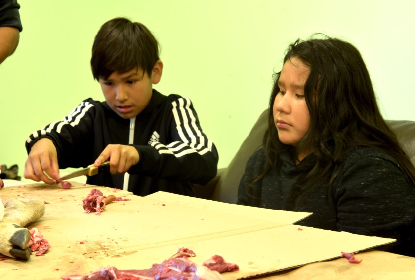 KelsiB. Carter Nash cutting up meat